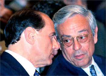 A 1997 picture shows talian prime minister Silvio Berlusconi (L) and lawmaker Cesare Previti. An Italian prosecutor demanded 30 May 2003 an 11-year prison sentence for lawmaker Cesare Previti, a close friend of Prime Minister Silvio Berlusconi, for alleged corruptions of magistrates. Berlusconi is a co-accused in Previti's trial but his case will be handled separately because of his repeated absences on official state duty