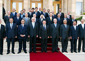 F_King Abdullah II of Jordan (front C) and Prime Minister Ali Abu Ragheb (to his right) pose for a group picture with the new government in Amman 21 July 2003. Abu Ragheb formed today a new government which, after a vote of confidence in parliament next week, is expected to push ahead with political and economic reforms. The new 28-member administration was sworn in before King Abdullah II a day after Abu Ragheb submitted his government's traditional resignation in the wake of the June general elections. AFP PHOTO/HO/Youssef ALLAN