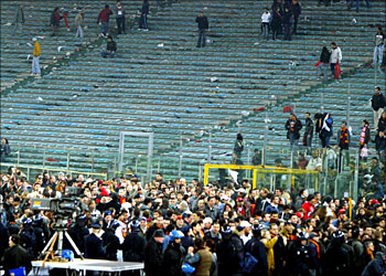 AS Roma and Lazio supporters leave Olympic stadium in Rome after the match was cancelled at half-time 21 March 2004. Players stopped the game when informed of an unfounded rumour alleging the death of a fan in a supposed incident with police outside the stadium. Authorities decided to suspend play to avoid a pitch invasion. Scuffles broke out between police and supporters leaving the stands