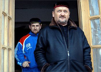 Picture taken 30 January 2004, shows Chechen President Akhmad Kadyrov (R) and his son Ramazan standing in front of Ramazan's house in Tsentoroy, Kadyrov's native village, some 40 km from Chechen capital Grozny 30 january 2004. The pro-Moscow Chechen leader was killed in a blast that rocked a stadium in the republic's capital Grozny, 09 May 2004, according to Interfax.