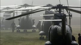 F/Parachutists of French special police unit EPIGN wait next to their helicopters in Caen, 06 June 2004
