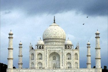 (FILES) In this picture taken 15 July 2003, birds fly across a stormy sky at the back of India's historic world heritage monument,