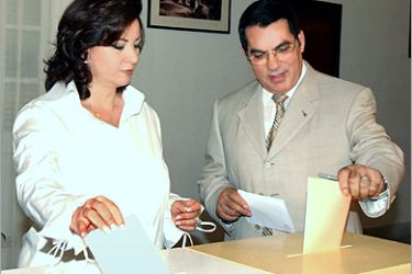 REUTERS - Tunisian President Zine Al-Abidine Ben Ali (R) and his wife Leila Ben Ali (L) vote in Tunis poling station,October 24,2004.