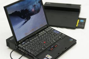 IBM's ThinkPad notebook computer combined with Sanyo Electric Co's prototype fuel cell battery is unveiled during a news conference in Tokyo April 11, 2005.