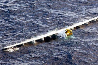 f_Fuselage and wings of the Tunisian passenger plane which crash-landed at sea floats in the waters off the
