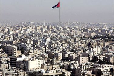 AFP / A general view shows a giant Jordanian national flag fluttering in the capital Amman 12 November 2005. Jordan braced for a long-haul fight against terrorism after its cherished stability