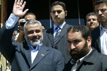 Palestinian Primer Minister Ismail Haniya waves after speaking to journalist in Gaza City 03 May 2006. Haniya said today his Hamas government has collected enough money