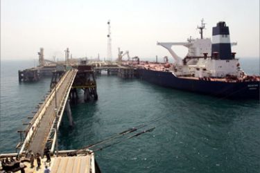 A ship is connected to the Basra Oil Terminal, 12 nautical miles off the Iraqi coast in the waters of the Northern Arabian Gulf, close to the port town of Umm Qasr August 8, 2006.