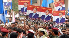 AFP / Yemenis hold pictures of Yemeni President Ali Abdullah Saleh during an electoral rally in Amran, 65 kms north of Sanaa, 31 August 2006 in the second day of Saleh's