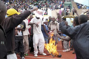 r_Rwandan protesters burn a French flag during a demonstration against a French judge’s call for the prosecution of President Paul Kagame in the capital Kigali