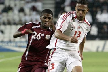 AFP/Qatar national team player and AFC's player of the year, Khalfan Ibrahim, (L) vies with Talal al-Junaibi of the United Arab Emirates (R) during the men's round 2 group A football match at the Al-Sadd Football Stadium during the 15th Asian Games in Doha 05 December 2006.