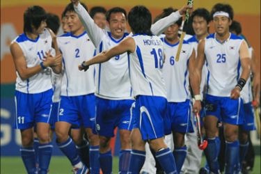 afp - South Korean players jubilate after defeating China during their men's field hockey final against at the 15th Asian Games in Doha