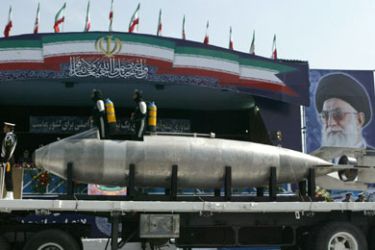 An Iranian made light submarine is displayed during the army day military parade, outside the mausoleum of the late founder of Islamic republic, Ayatollah Khomeini (poster) in