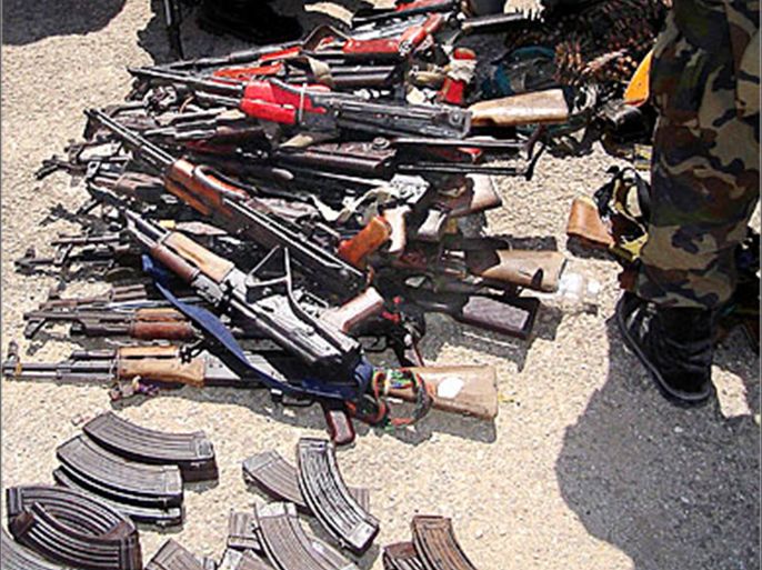 AFP / Picture taken 03 May 2007 shows arms surrendered by businessmen in strife torn capital, Mogadishu, lying at the feet of Africa Union (AU) soldiers and Somali government
