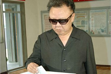 REUTERS/ North Korean leader Kim Jong-il casts his vote for the election of deputies to the provincial, city and country people's assemblies, into a ballot box at a polling station in