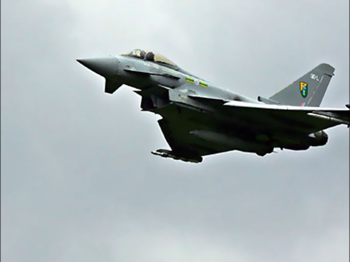 f_In a file picture dated 11 July 2007, a Eurofighter Typhoon aircraft flies past RAF Coningsby in Lincolnshire, in north-east England, during a media preview. The Saudi