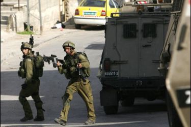 F/Israeli soldiers are seen during a military operation into the Israeli occupied northern West Bank city of Jenin as they looked for Palestinians on their wanted list 06 September 2007