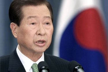 South Korea's then-President Kim Dae-jung attends a news conference at the presidential Blue House in Seoul in this February 14, 2003
