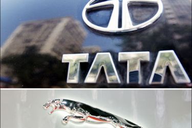 afp : (FILES) Photo shows the Tata logo (top) shining on the boot of a car reflecting high-rise buildings of south Mumbai's business district, 31 January 2007 and (bottom) the logo of