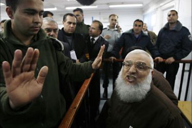 r_Hamas member and speaker of the Palestinian parliament Aziz Dweik (R) sits in the dock during evidentiary proceedings at Israel's Ofer military court near the