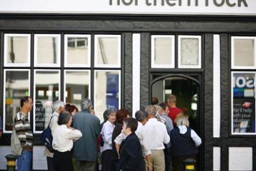 (FILES) File picture of customers queue to enter a Northern Rock bank branch in Bromley, in south-east London, on September 14, 2007. Thousands of people could die from
