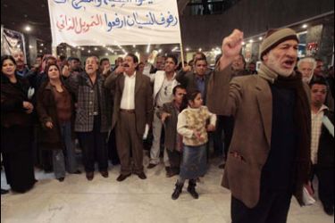 AFP PHOTO/Iraqi artists shout slogans during a demonstration at the Iraqi national theatre in Baghdad on February 4, 2008.