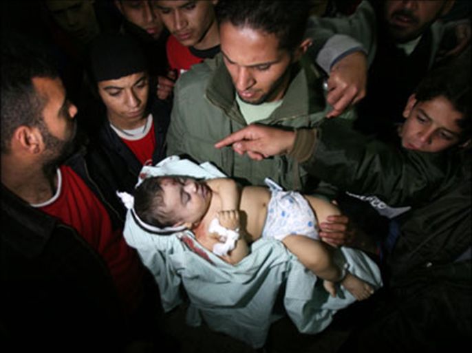 afp - Palestinians carry the body of Six-month-old Mohammed Bourai to the morgue at al-Shifa hospital in Gaza city on February 27, 2008. A baby boy was killed Wednesday
