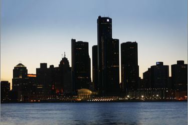 REUTERS/The Detroit skyline is shown during Earth Hour across the river from Windsor, Ontario March 29, 2008. Cities around the world switched