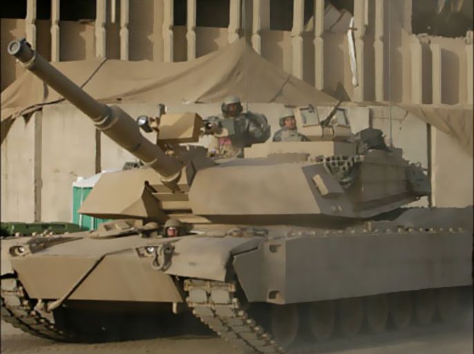 r_U.S. soldiers ride on an M1 Abrams tank as it rolls into U.S. army Forward Operating base Loyalty after a mission in Baghdad April 15, 2008. REUTERS