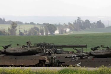 Israeli tanks are seen stationed near Sderot in southern Israel, some kilometers away from the Gaza Strip, on March 3, 2008. Prime Minister Ehud Olmert vowed today that Israel