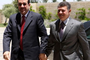 AFP/ In a handout picture released by the Jordanian Royal Palace, Iraqi Prime Minister Nuri al-Maliki (L) holds hands with Jordan's King Abdullah II (R) as they meet in Amman on June 12, 2008.