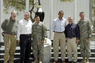 r : U.S. Democratic presidential candidate Barack Obama (3rd R) poses for a photo at a military base in Afghanistan July 19, 2008. U.S. Democratic presidential candidate