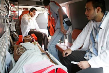 f_A Palestinian patient is seen in an ambulance at the Rafah border crossing in the southern Gaza Strip waiting to cross into Egypt on August 30, 2008