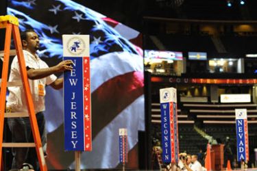 A worker installs the New Jersey delegation sign on August 30, 2008 during preparations for the Republican National Convention at the Xcel Energy Center in St. Paul, Minnesota.