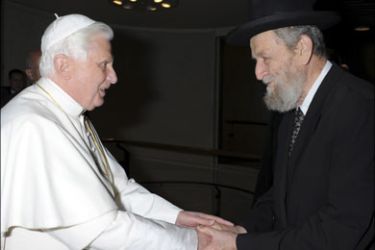 r : Rabbi Shear-Yashuv Cohen (R), Chief Rabbi of Haifa, shakes hand with Pope Benedict XVI as he arrives at the Nervi Hall at the Vatican for the Synod of the Bishops