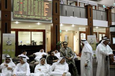 afp : Relaxed Emirati investors follow the changes in stock prices at the Dubai Financial Market as stock markets in the Middle East, including the oil-rich Gulf, rebounded on October