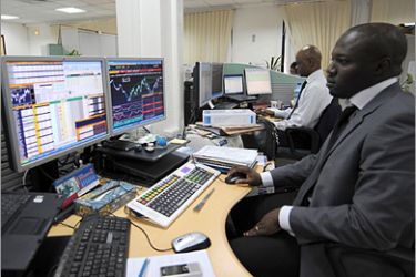AFP - African traders follow the market's movement at the Stock Exchange in African Development Bank (BAD) on November 11, 2008 in Tunis. In parallel to the African Economic