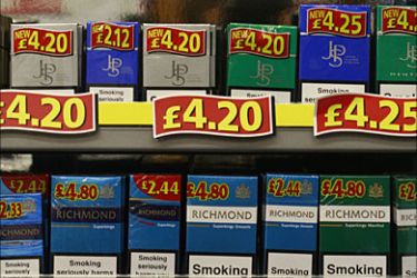 r_Cigarettes are seen on sale in a newsagents in London December 9, 2008. Britain's Government announced on Tuesday that open displays of tobacco in shops is to
