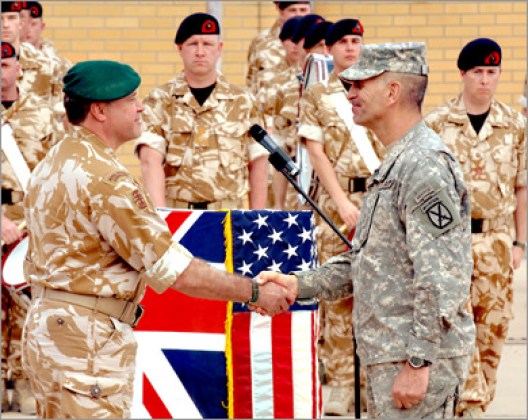 AFP - A handout picture obtained March 31, 2009, from the British Ministry of Defence, shows UK General Officer Commanding Major General Andy Salmon (Front L) handing over command to Major General Michael Oates of the US Army in Basra, Iraq. British troops launched their pullout from Iraq