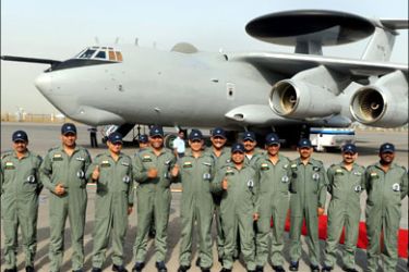 afp : Indian Air Force (IAF) officers and crew of the Airborne Warning and Control System (AWACS) aeroplane pose for the media during the induction ceremony of the first AWACS