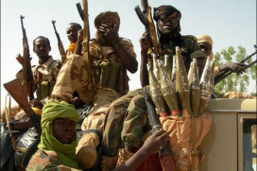 afp : (FILES) This picture taken on June 18, 2008 in Am Zoer shows Chadian soldiers posing on a vehicle. Chad rebels who entered the country from Sudan are within about 100