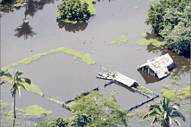 REUTERS / An aerial view of a flooded farm in the northeastern state of Maranhao, in this May 12, 2009 file photo. A bout of extreme weather, including floods in the north and drought in the south, has reignited the debate about how climate change is affecting Latin America's largest country, home to the world's biggest rain forest and one of the world's bread baskets.