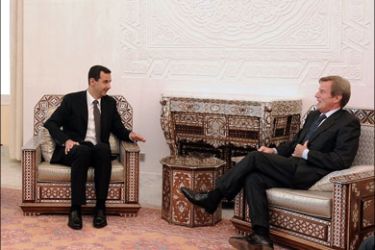 AFP : A handout picture from the Syrian Arab News Agency (SANA) shows Syrian President Bashar al-Assad (C) and his Foren Minister Walid Muallem (L) meeting with French