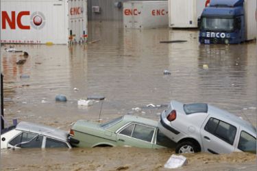 Partially submerged vehicles are seen after heavy rains in Istanbul September 9, 2009