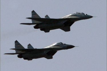 Iran's Mig-29 fighter jets fly during an annual military parade which marks Iran's eight-year war with Iraq, in the capital Tehran on September 22, 2009