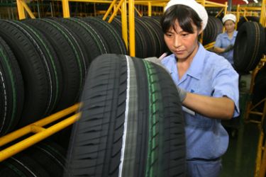 (FILES) This file photo taken on July 25, 2007 shows workers conducting quality control checks on their tyres at a factory in Hangzhou. The Chinese embassy
