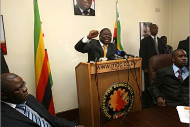 Movement for Democratic Change (MDC) leader and Prime Minister of Zimbabwe Morgan Tsvangirai (C) addresses a press conference at the party's headquarters at Harvest House in Harare on October 16,2009. Prime minister Tsvangirai said his party is disengaging from cabinet and