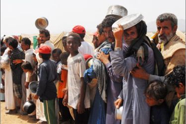 File picture dated October 9, 2009 shows Yemeni refugees lining up to get food aid at the Marzaq internally displaced people's camp in Harad in the northwestern province of Hajjah
