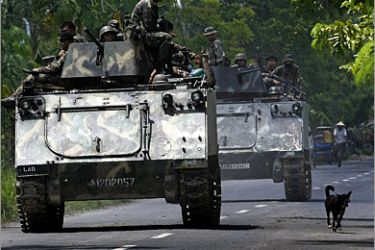(FILES) This file photo taken on May 26, 2009 shows Philippine Army armoured personnel carriers and trucks move down a highway of the town of Datu Piang in Maguindanao on military actions against separatist rebels.