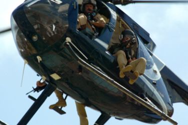 (FILES) -- A picture dated January 24, 2007 shows members of the US private security company Blackwater patroling over Baghdad. Iraq has filed a lawsuit against private security firm Blackwater in a US court and will file another in Iraq, Prime Minister Nuri al-Maliki said on January 4, 2010,